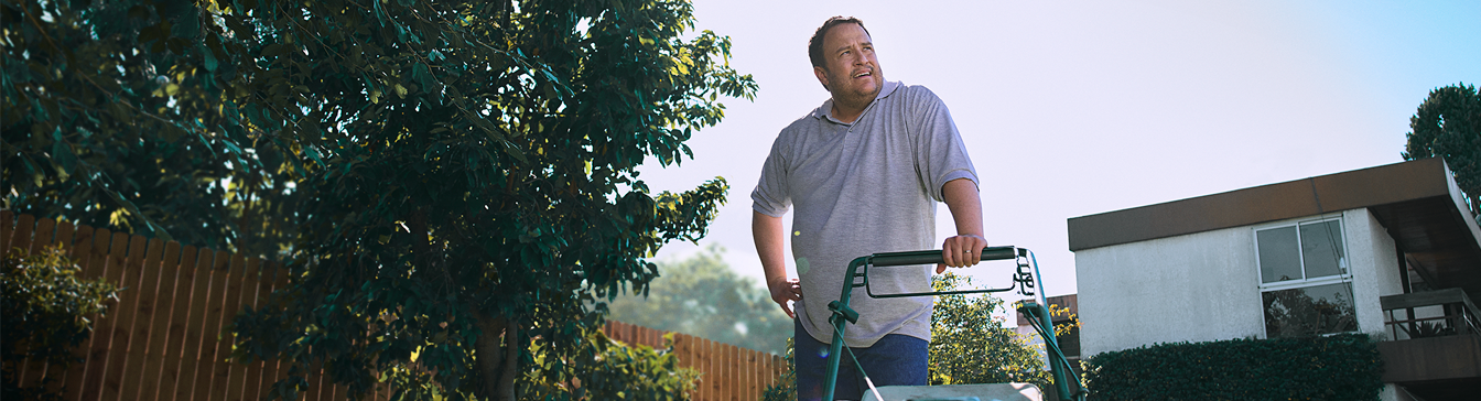 Man mowing lawn.